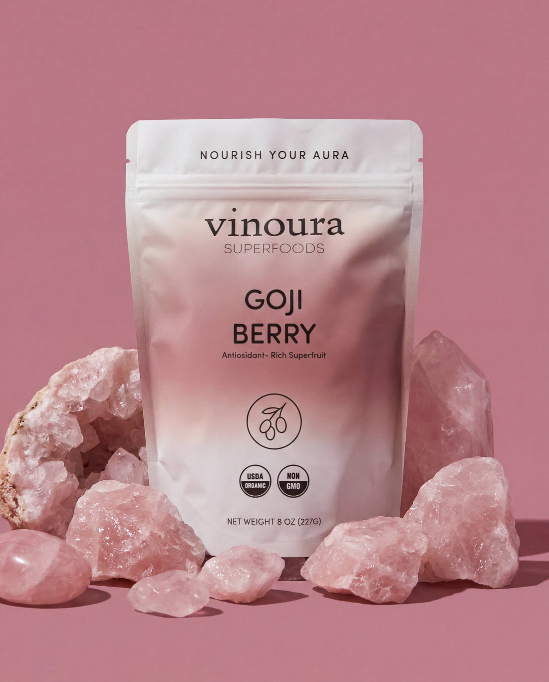 Vinoura Goji Berry package with pink crystals on a pink background