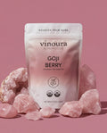 Vinoura Goji Berry package with pink crystals on a pink background